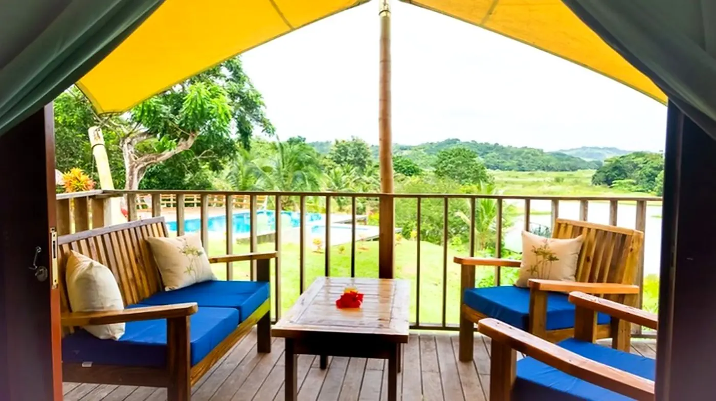 Cabin balcony overlooking the pool and the lake
