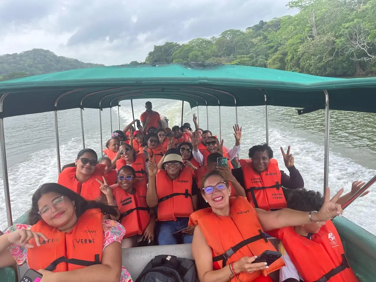 Happy group of visitors on the Jungle Land boat