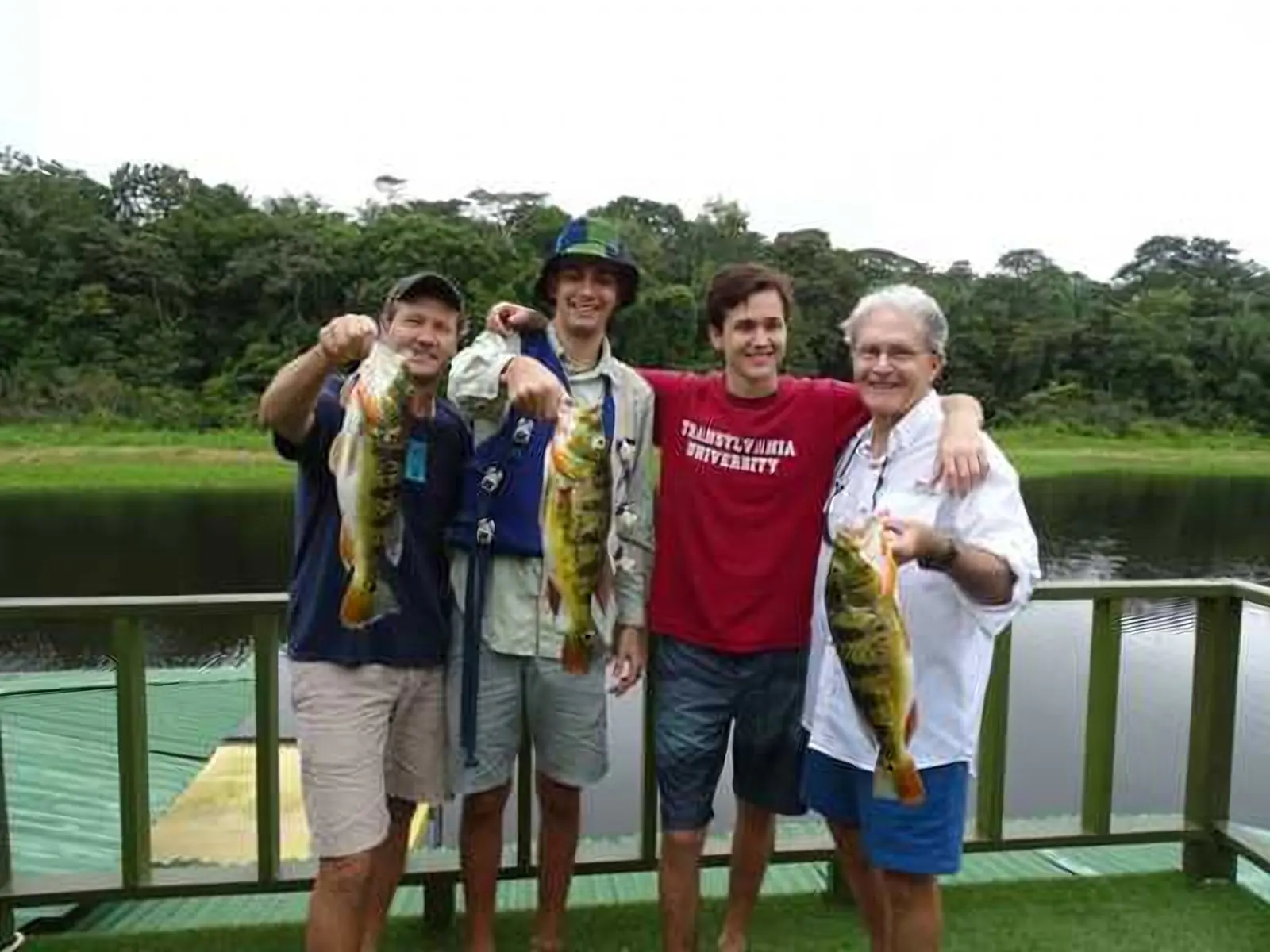 Group of anglers showing freshly caught peacock bass on Gatun Lake